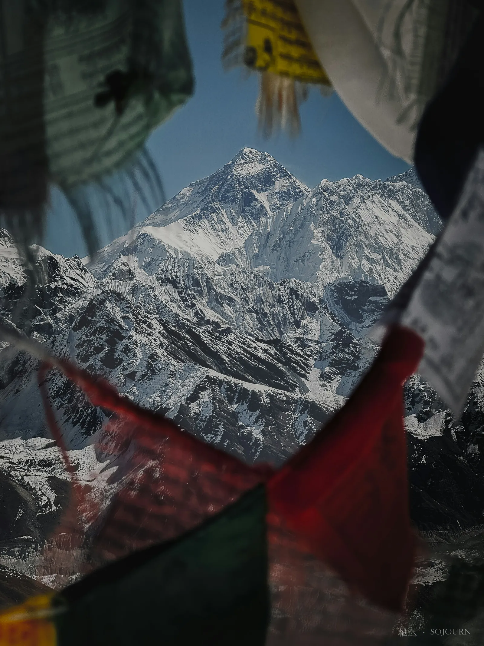 Between the prayer flags